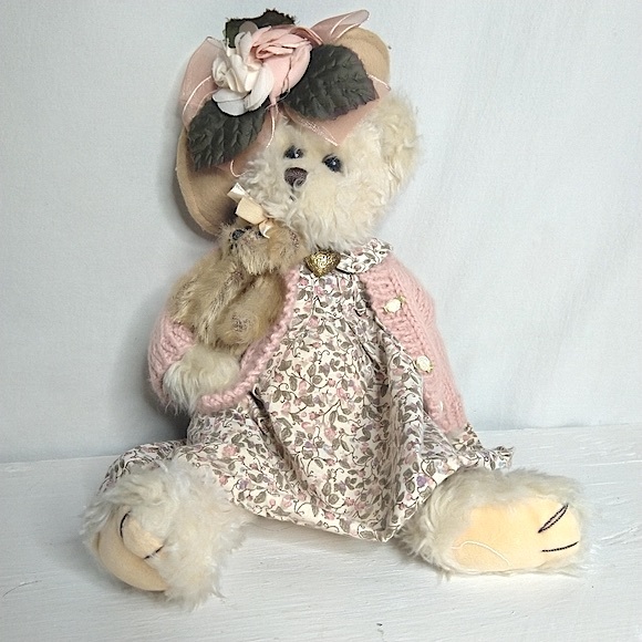 Adorable Berenstain Mama Bear with flowered hat and charm.